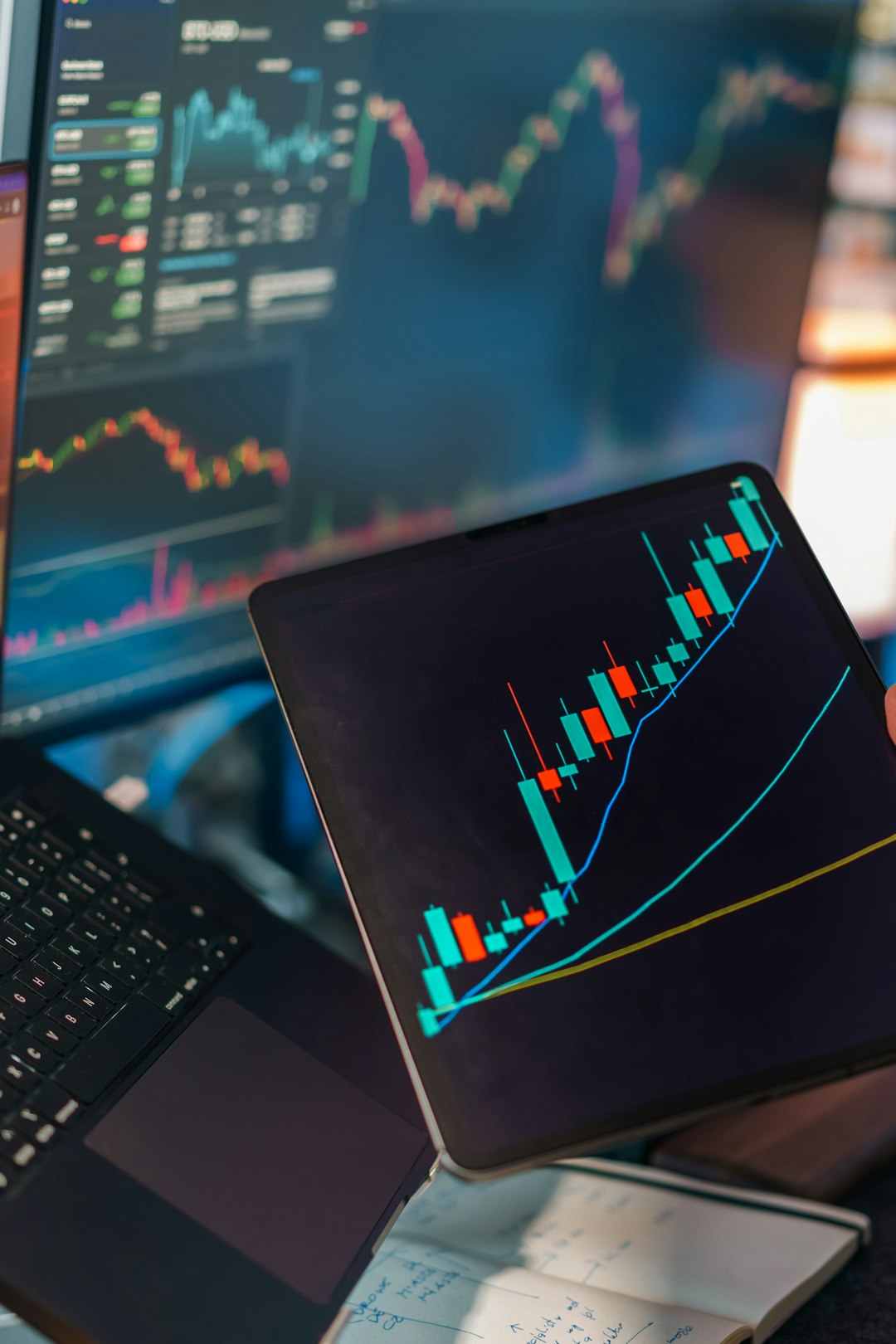 mobile-01 Financial trading analytics candlestick chart laptop tablet. Digital market analysis workspace showing price movement graphs technical indicators data visualization screens investment finance concept editorial business technology